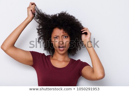 Stock fotó: Close Up Portrait Of An Upset Young Girl With Curly Hair