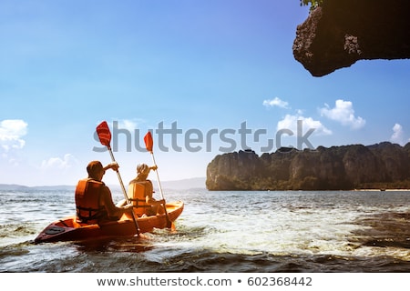 Stok fotoğraf: Couple Paddling In Kayak