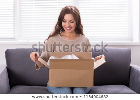 Imagine de stoc: Woman Receiving A Package