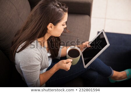 Stok fotoğraf: Above View Of Young Female Using Tablet On The Sofa