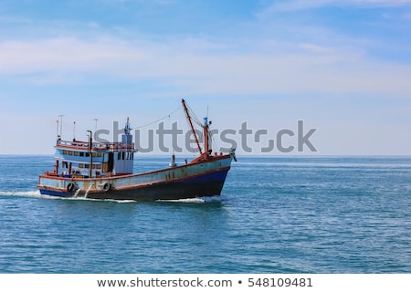 ストックフォト: Small Old Fishing Boat In The Ocean