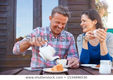 Foto stock: Portrait Of Mature Couple Shopping At Garden Center