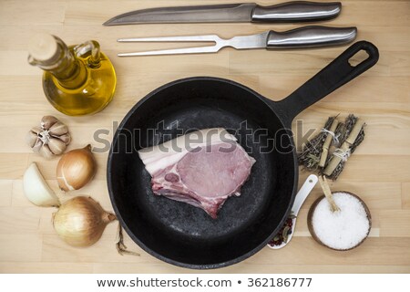 [[stock_photo]]: Pieces Of Fresh Raw Pork Appetizing Close Up On Black Stone Background