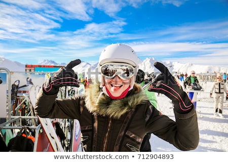 Foto stock: Young Smiling Woman In Ski Helmet And Goggles
