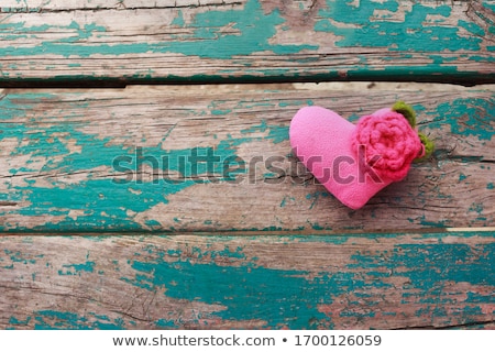 Stockfoto: Red Heart Shape Made From Wool On Old Shabby Wooden Background