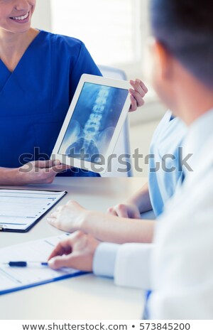 Zdjęcia stock: Close Up Of Happy Doctor With Tablet Pc At Clinic