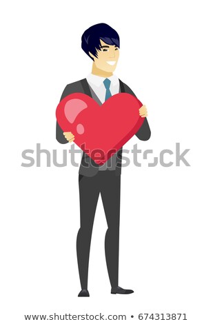 Stockfoto: Asian Groom Holding A Big Red Heart