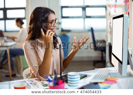 Stok fotoğraf: Female Designer Talking On Phone