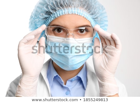 Zdjęcia stock: Female Doctor Or Nurse Wearing Goggles Surgical Gloves And Face