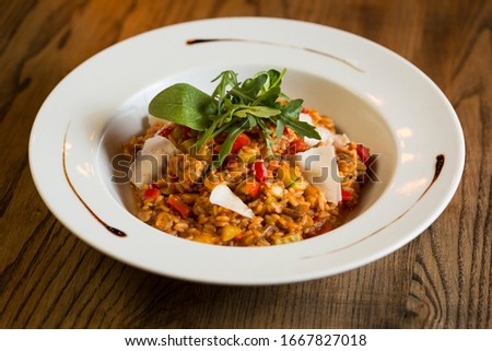 Stockfoto: Risotto With Chicken Meat Zucchini And Mushrooms In Cream Sauce