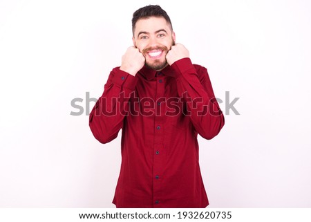 Сток-фото: Pleased Attractive Businessman With Positive Smile Keeps Hands Crossed Dressed In Formal Suit Sta