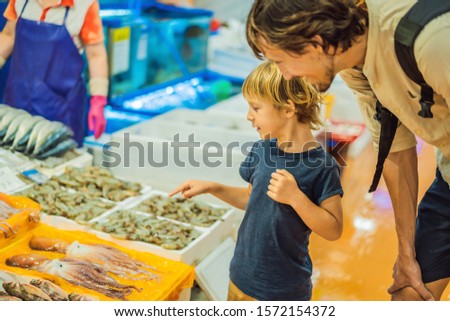 Stock photo: Dad And Son In The Korean Market Raw Seafood At Noryangjin Fisheries Wholesale Market In Seoul Sou