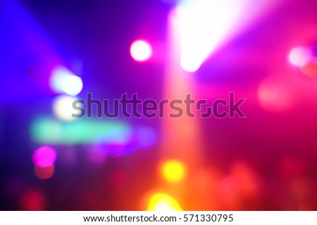 Foto stock: Blurred People Dancing With Original Laser Color Lights - View O