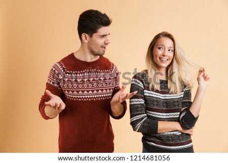 Zdjęcia stock: Man Looking At Flirty Woman Who Looking Aside Playing With Hair