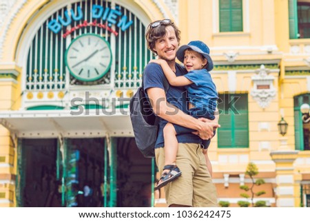 Stok fotoğraf: Father And Son On Background Saigon Central Post Office On Blue Sky Background In Ho Chi Minh Vietn