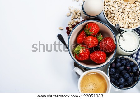 Stockfoto: Healthy Breakfast On White Bowls Fresh Granola Muesli Or Cereal With Berries