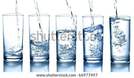 Foto d'archivio: Bottle Of Sparkling Mineral Water With Glass Of Ice And Green Cloth On White