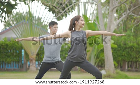 Stockfoto: A Mother Training With Baby On A Summer Day