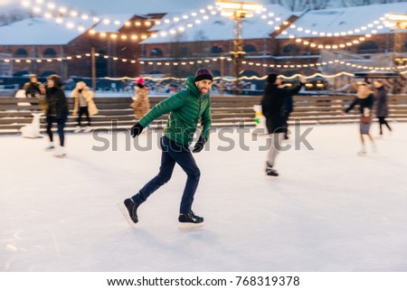 Stock photo: Outdoor Shot Of Attractive Man With Beard Wears Warm Winter Clo