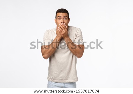 Stockfoto: Speechless Shocked Young Hispanic Tanned Man In Good Shape Cover Mouth With Hands And Popping Eyes