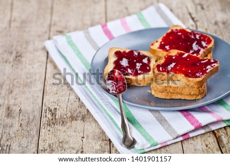 Сток-фото: Homemade Cherry Jam And Fresh Toasted Cereal Bread Slices Plates