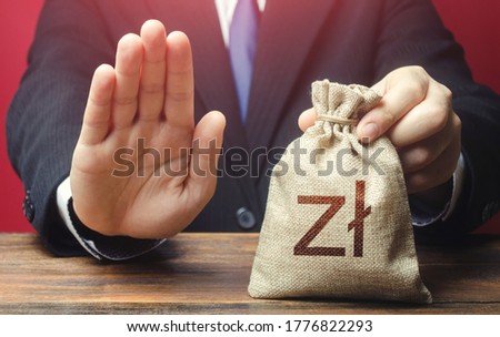 [[stock_photo]]: Businessman Refuses To Give Polish Zloty Money Bag Loan Refusal Bad Credit History Asset Freeze