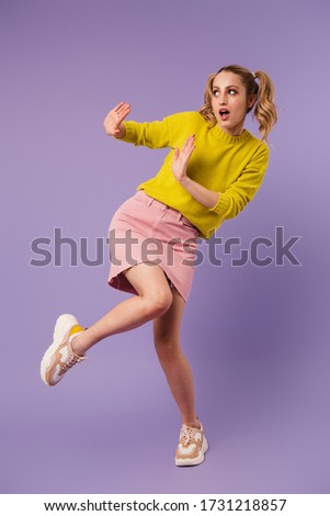 [[stock_photo]]: Image Of Scared Pretty Woman With Two Tails Making Stop Gesture