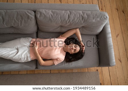Stockfoto: Day Dreaming - Caucasian American Female Relaxed At Home Having
