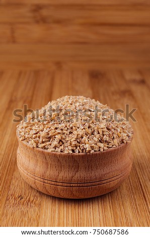 Stock foto: Wheat Groats In Wooden Bowl On Brown Bamboo Board Closeup Rustic Style Healthy Dietary Cereals B