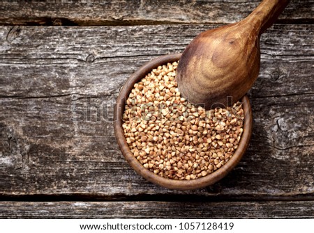 Stock photo: Buckwheat In Wooden Bowl And Spoon Groats In Wood Dish And Shov