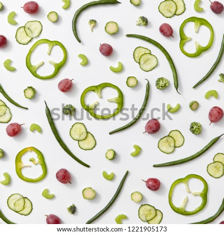 The Pattern Of Pieces Of Cucumber Grapes Cabbage And Asparagus On A Gray Background Organic Ingre Сток-фото © artjazz