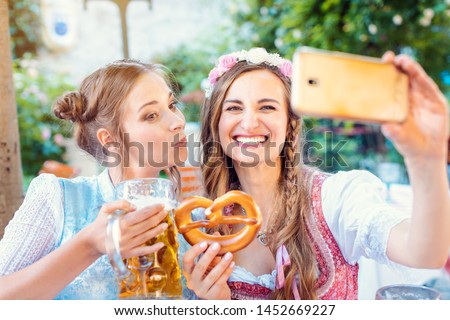 Stock fotó: Best Friends In Bavarian Tracht Making A Selfie With The Phone
