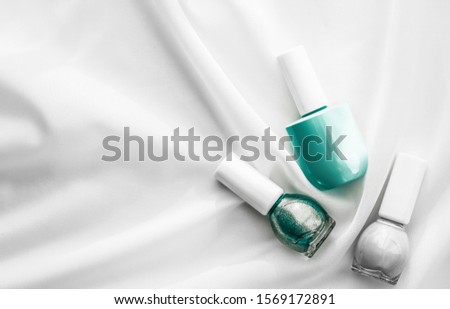 ストックフォト: Nail Polish Bottles On Silk Background French Manicure Products