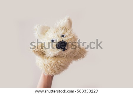 Сток-фото: Puppet Show Dog On A Gray Background Space For Text Or Replicas