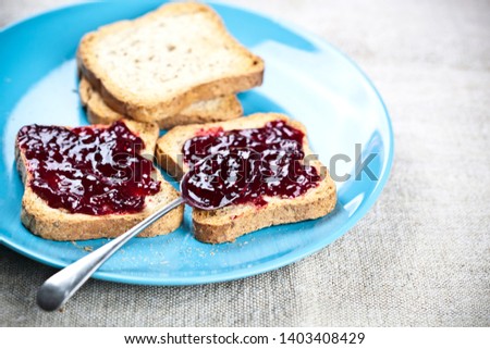 Stockfoto: Toasted Cereal Bread Slices On Blue Ceramic Plate And Homemade C