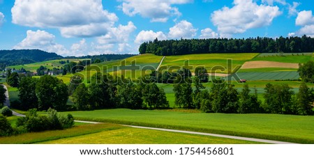 Stockfoto: German Idyllic Pastoral Countryside In Spring With Alps In Backg