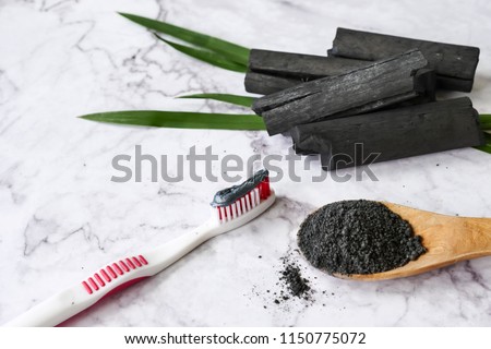 Stockfoto: Activated Charcoal Powder For Brushing And Whitening Teeth Bamboo Eco Brush