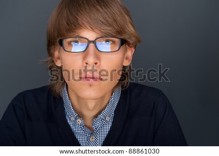 Stock fotó: Portrait Of Young Man With Smart And Wise Look Looking At Camer