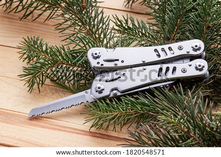 Stock photo: Multitool Pliers On Wooden Background