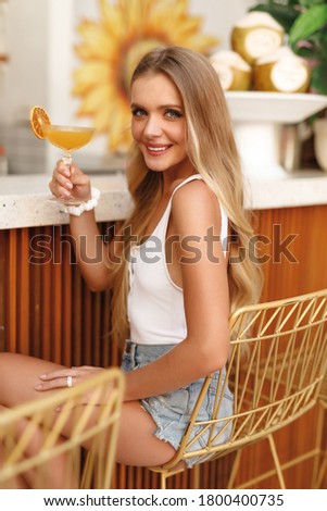 ストックフォト: Young Pretty Blond Woman In A Orange Bikini And Sunglasses Enjoy