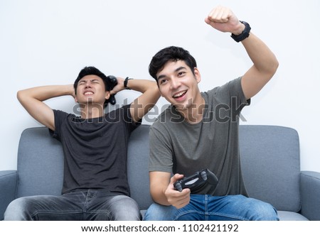 Stock foto: Image Of Asian Teenage Gamer Boy Losing Video Games While Playin