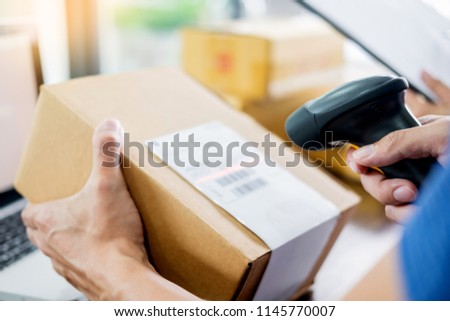 Stockfoto: Courier Hands Business Woman Work At Home Office Checking Parcel