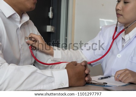 Stok fotoğraf: Doctor Is Checking On Patients Chest Uses Stethoscope To Listen