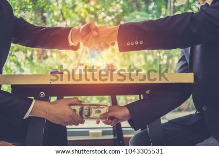 Stock photo: Bribe And Corruption Concept Corrupted Businessman Sealing The
