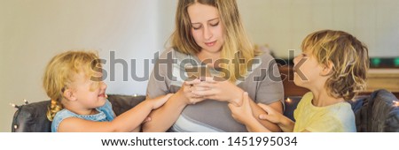 Stock photo: Mom With A Smartphone Digital Addiction Children Want To Spend Time With Mom But Can Not