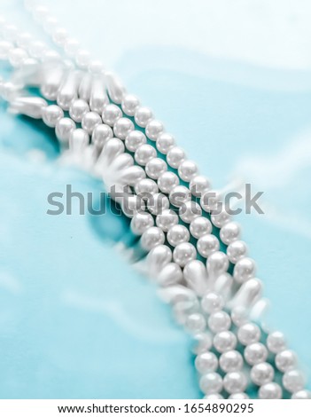 Сток-фото: Coastal Jewellery Fashion Pearl Necklace Under Blue Water Backg