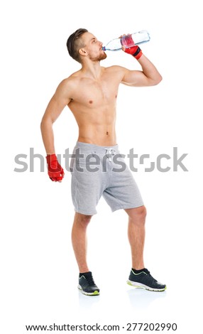 Foto stock: Sport Attractive Man Wearing Boxing Bandages And Drinking Fresh
