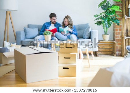 Stock fotó: Loving Young Couple Reading A Book In The Room