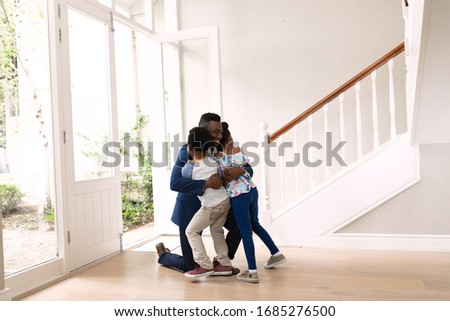 Stockfoto: Front View Of African American Siblings Interacting With Each Other While Sitting At The Dining Tab