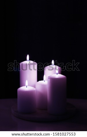 Foto stock: Aromatic Purple Floral Candles Set At Night Christmas New Year